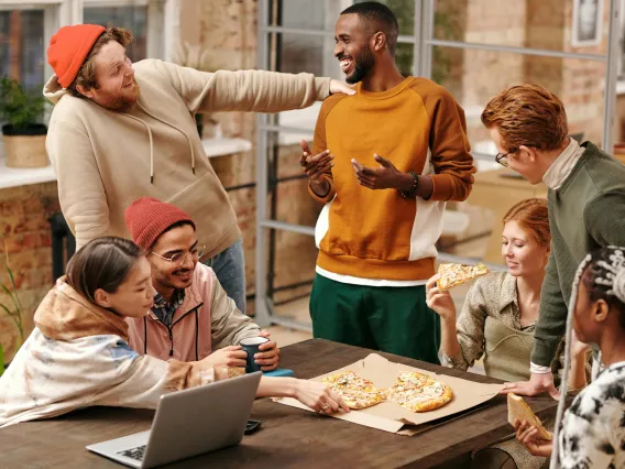 Group of people eating at a table outside