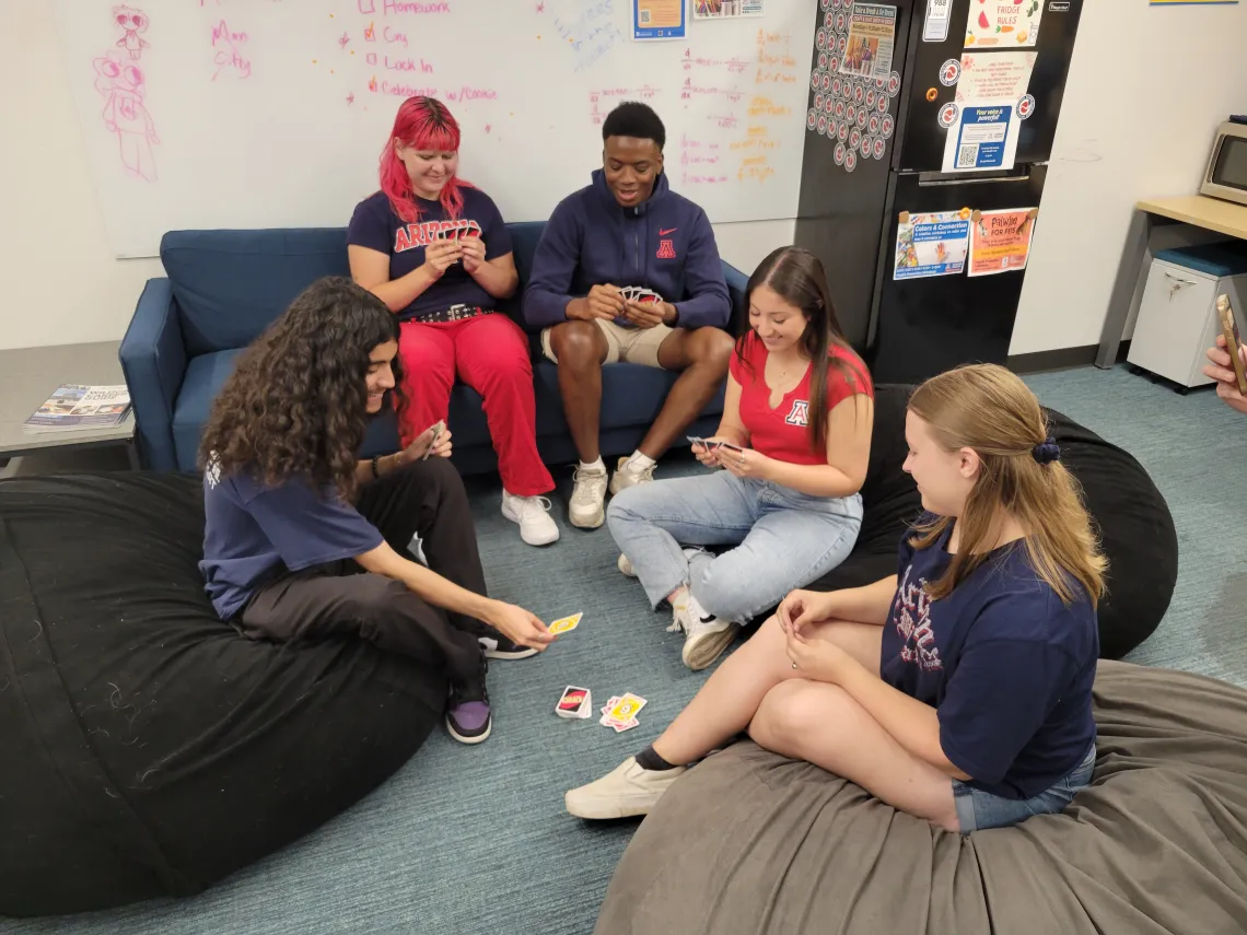 People playing Uno card game